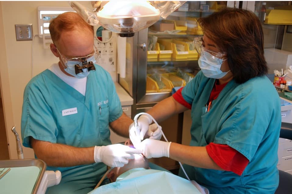 dentists treating a patient